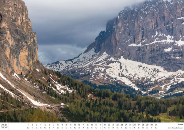 2025 Dolomiten Calendar, May. Photograph of snowy mountains, rising out of the Gröden Valley.