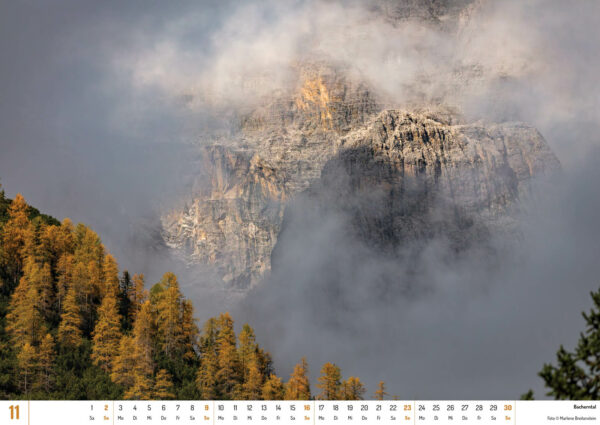 2025 Dolomiten Calendar, November. Photograph of a foggy mountain in Bacherntal Valley.